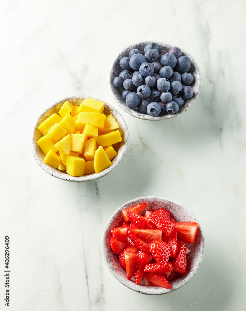 bowls of fresh fruit and berries