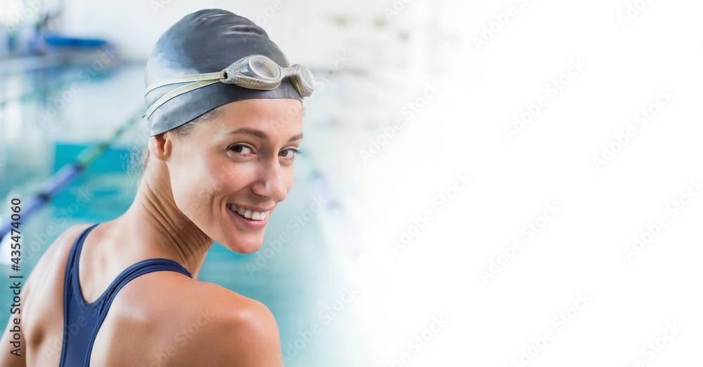 Composition of female swimmer smiling over white blur