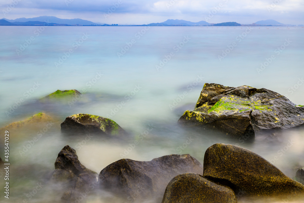 Landscape with beach,the sea and the beautiful clouds.rocks on the beach.