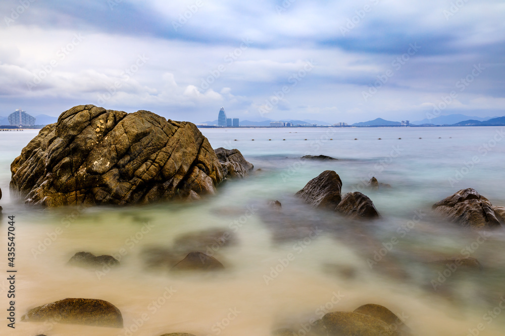 Landscape with beach,the sea and the beautiful clouds.rocks on the beach.