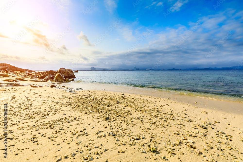 Landscape with beach,the sea and the beautiful clouds in the blue sky.rocks on the beach.