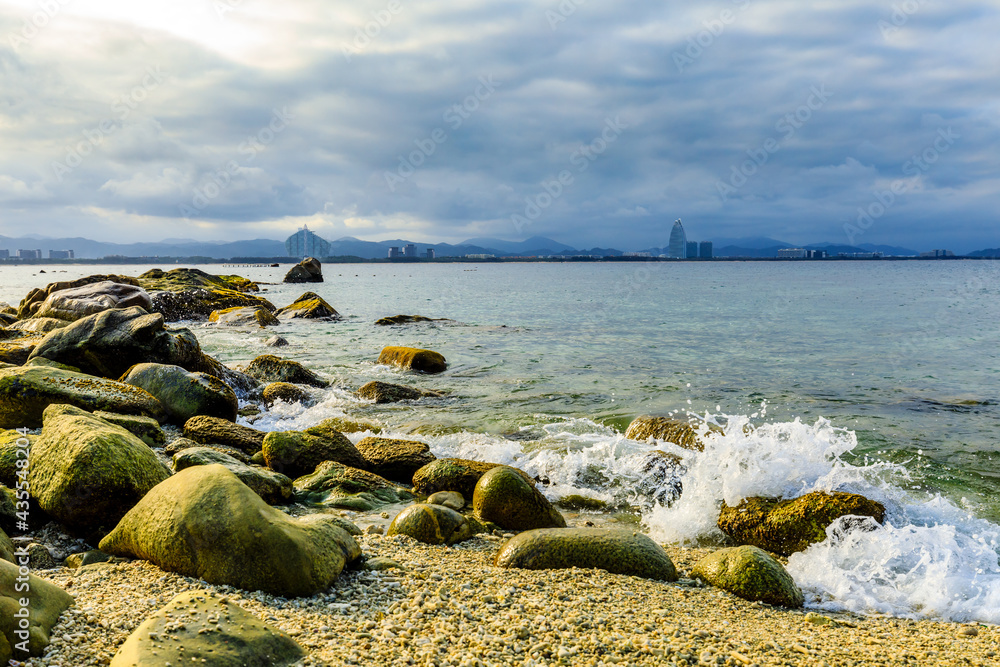 Landscape with beach,the sea and the beautiful clouds in the blue sky.rocks on the beach.