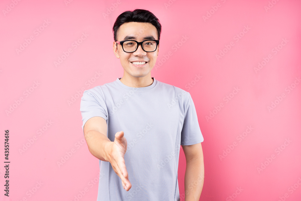 Portrait of Asian man posing on pink background with many expression