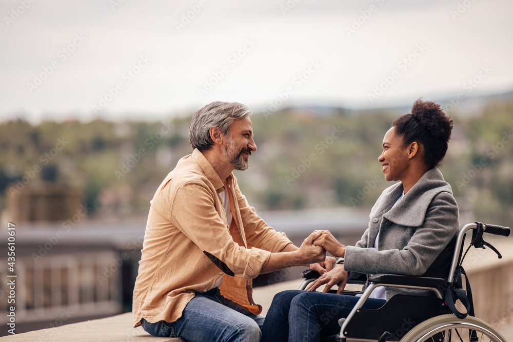 Smiling faces, lovers looking at each other, holding hands.