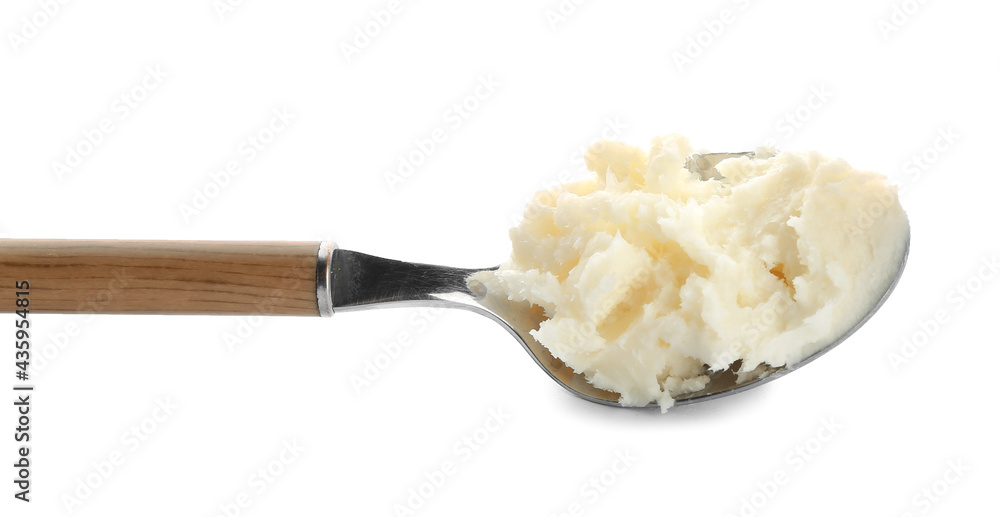 Spoon with shea butter on white background