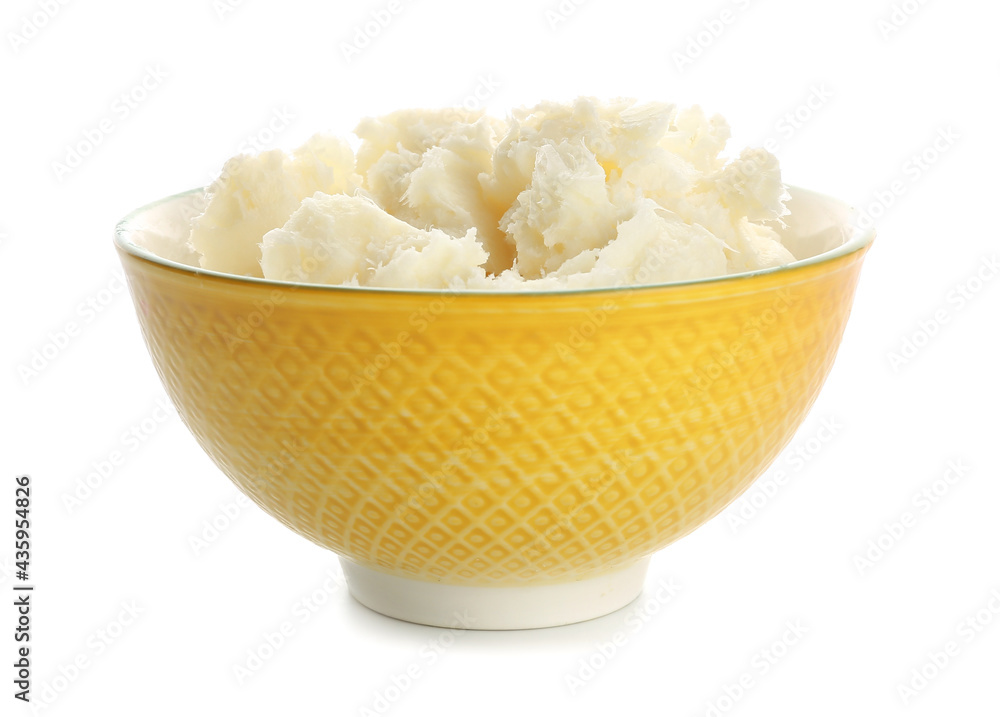 Bowl with shea butter on white background