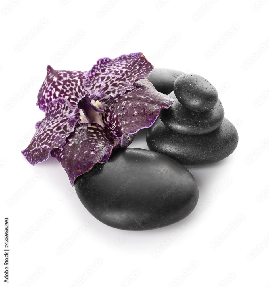 Spa stones and flower on white background