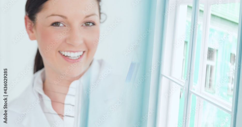 Composition of smiling female caucasian scientist working in laboratory and copy space