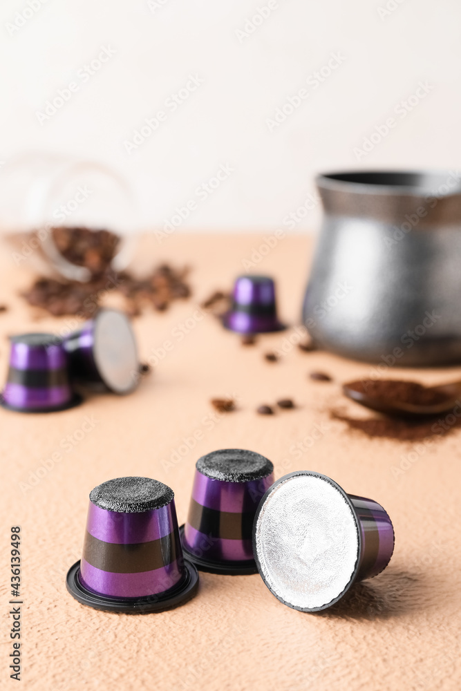 Coffee capsules on color table