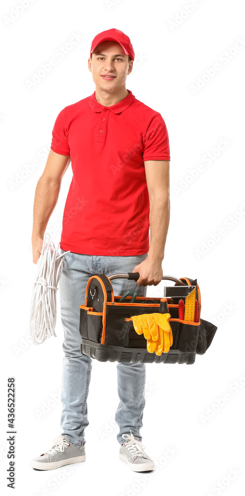 Young electrician with tools on white background