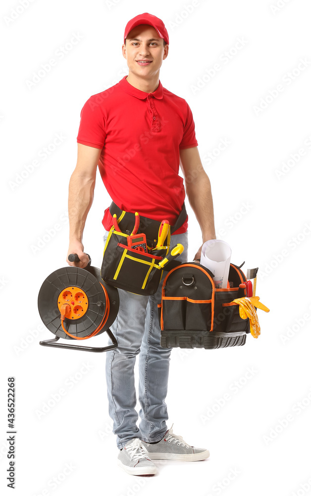 Young electrician with tools on white background