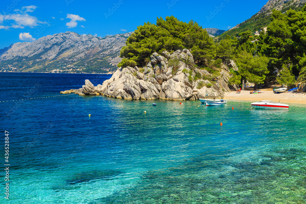 Anchored motorboats in the beautiful bay in Brela, Dalmatia, Croatia