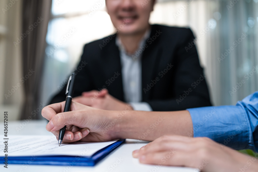 Businesswoman sign contract agreement on paper after negotiation deal