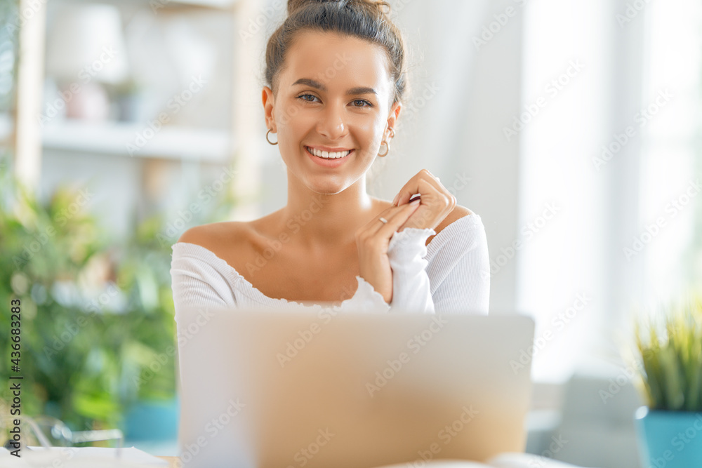 woman working on laptop at home