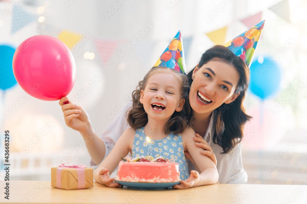 Mother and daughter are celebrating birthday.