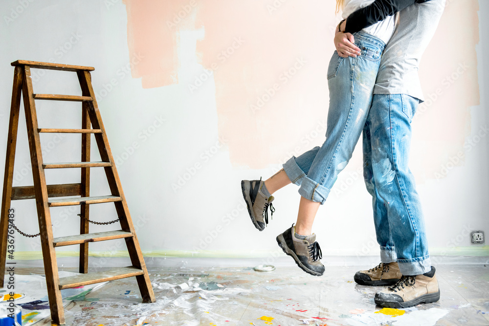 Happy couple renovating the house