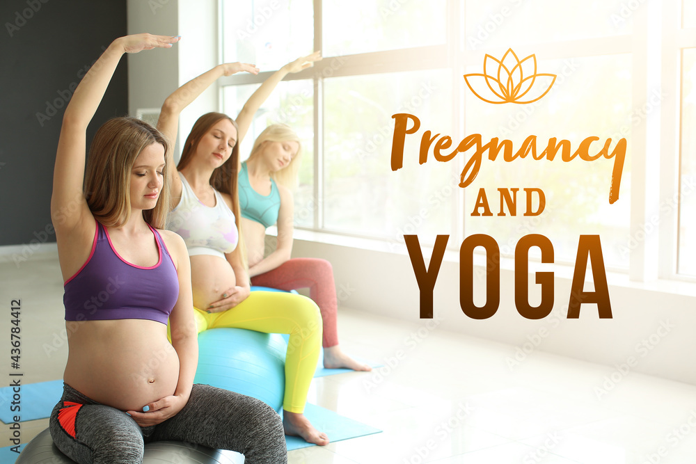 Young pregnant women practicing yoga in gym