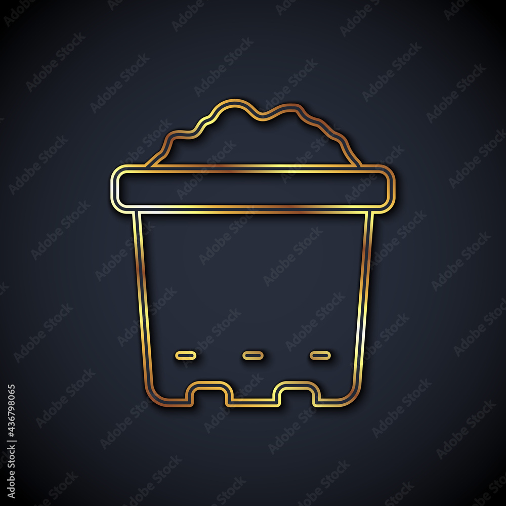 Gold line Pot with soil icon isolated on black background. Vector