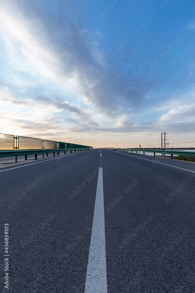 road bridge surface with sunrise sky