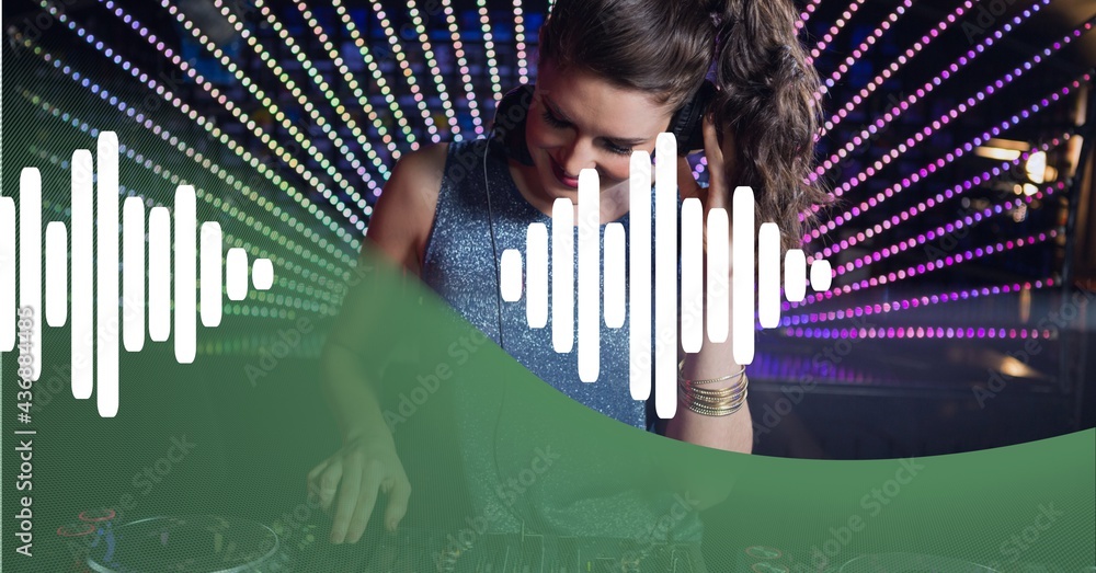 Composition of green curve and white sound level meter over smiling female dj and colourful lights