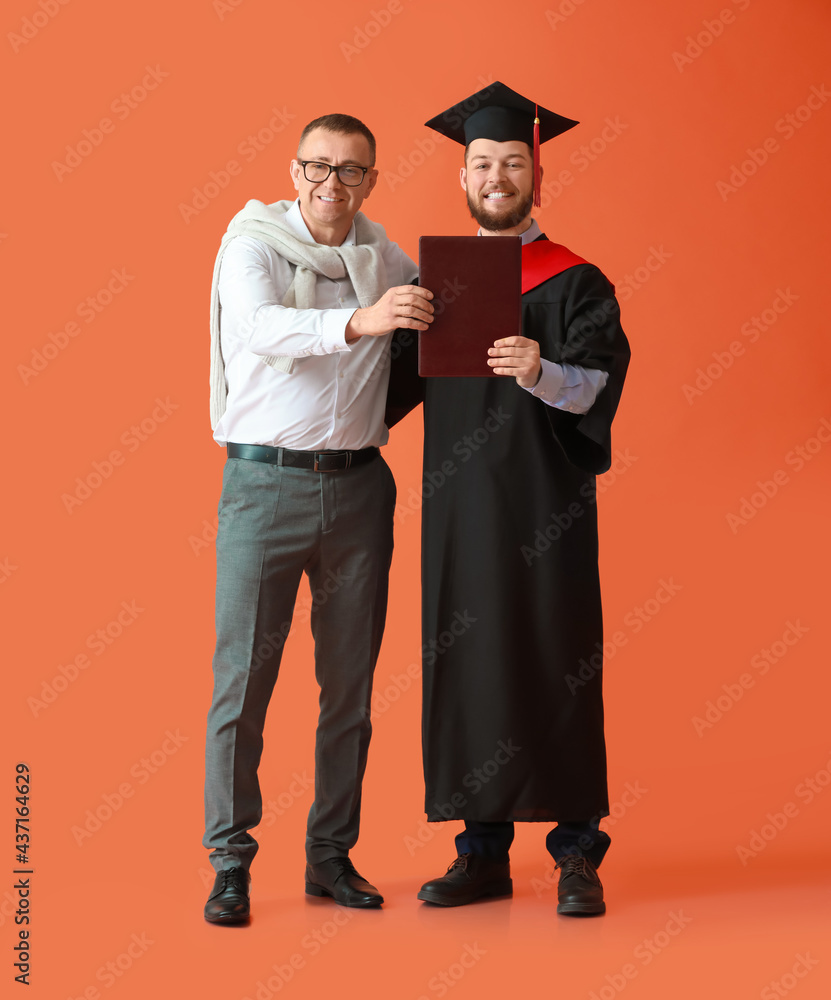 Happy male graduation student with his father on color background