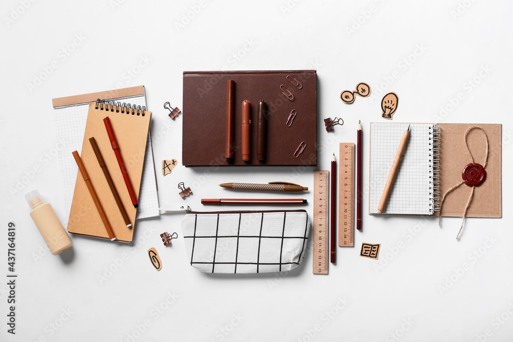 Pencil case with stationery on white background