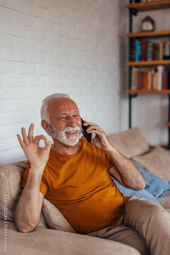 Senior man, making hand gestures, while calling his partner.