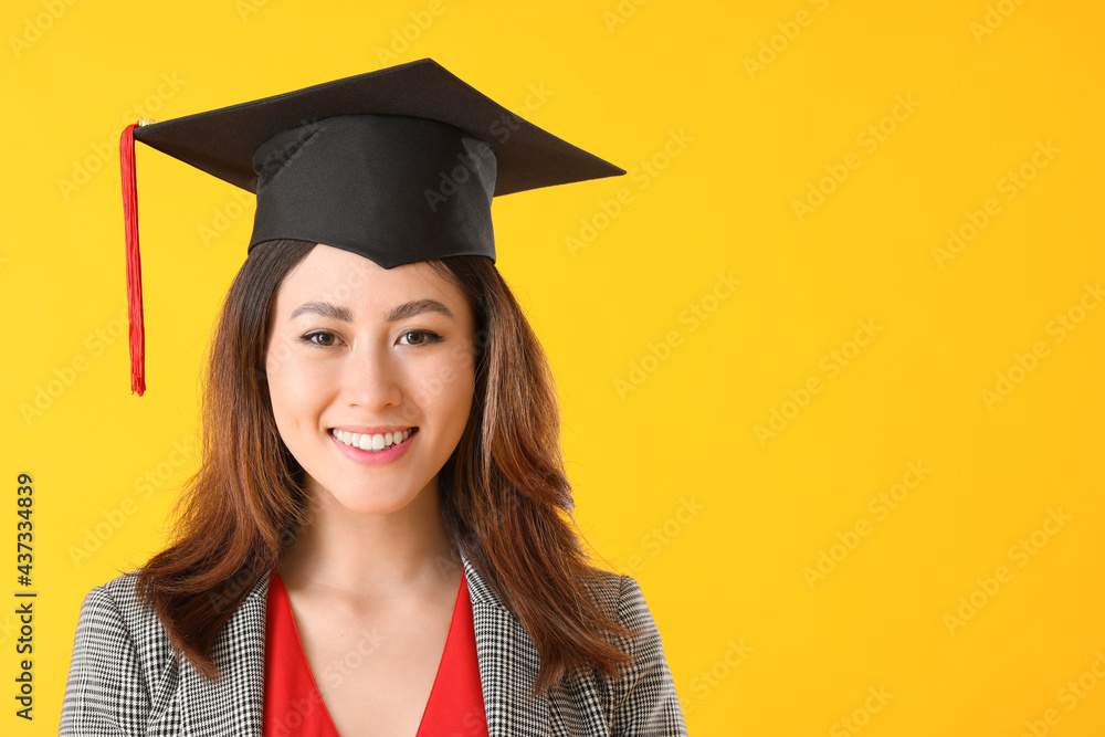 Female graduating student on color background