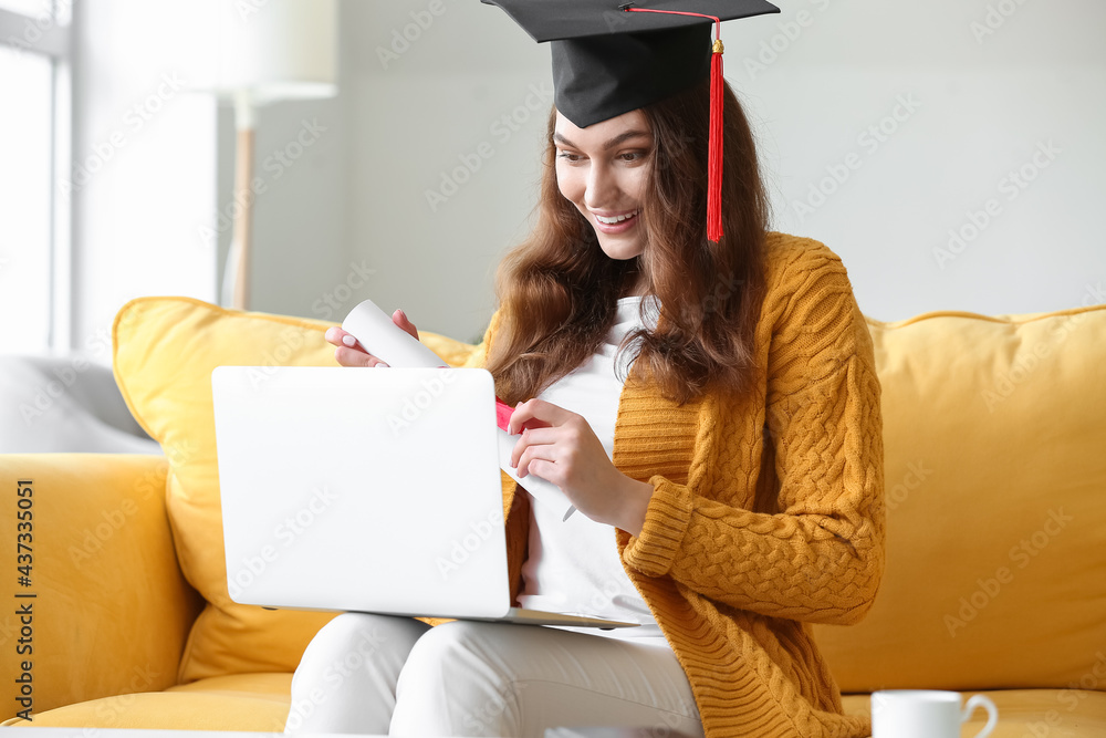 Happy female student on her graduation day at home. Concept of studying online