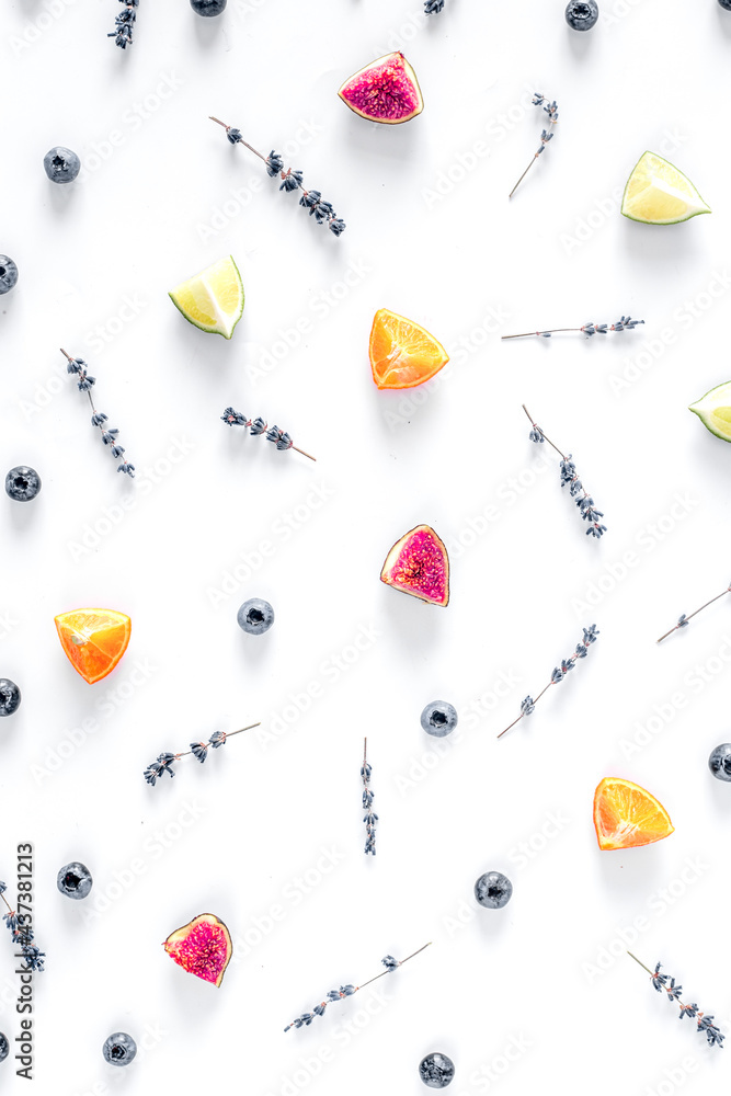 berry pattern with fruit and lavander on white desk background top view