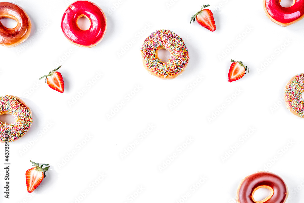 sweet colorful donuts with topping white desk background top view mock-up