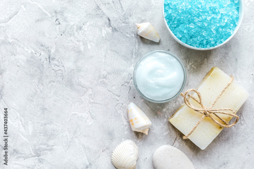 spa composition with blue salt and soap on stone background top view mockup