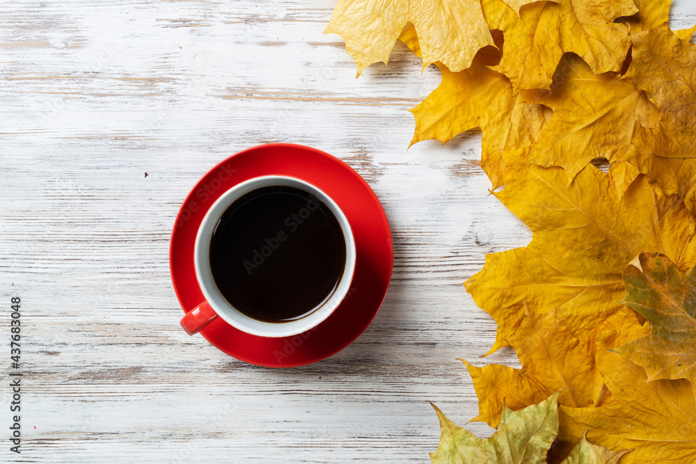 Flat lay autumn composition with cup of black tea