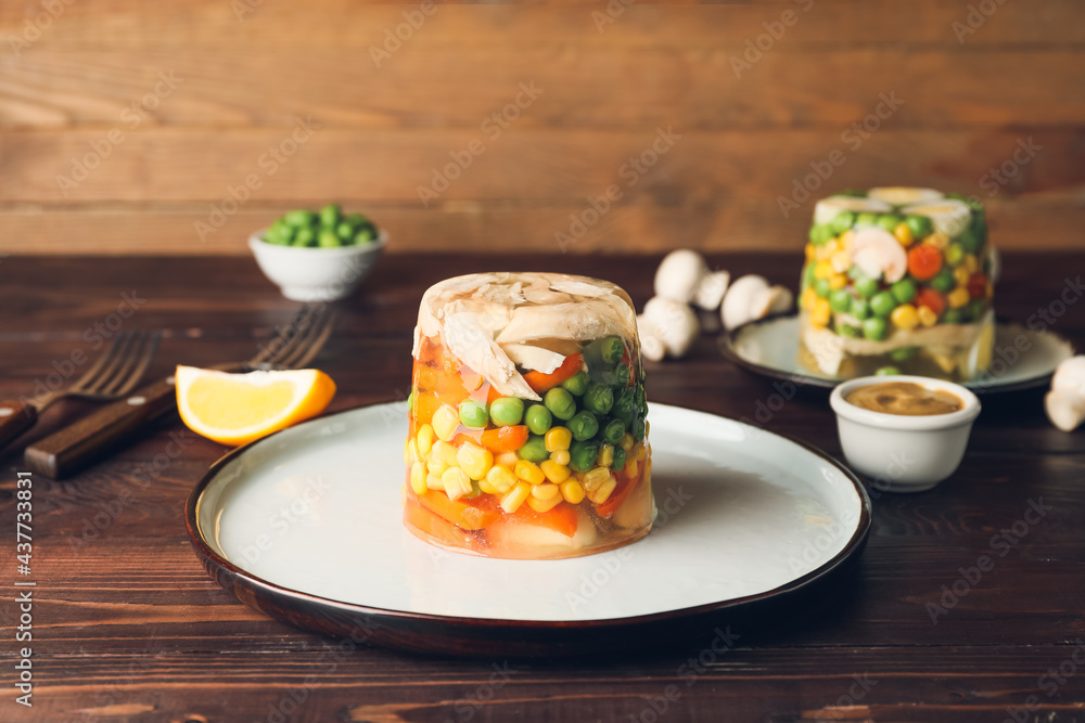 Plate with tasty aspic on table