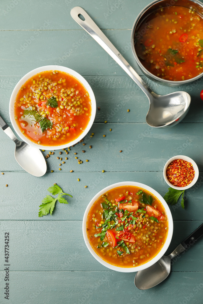 Tasty lentil soup on wooden table