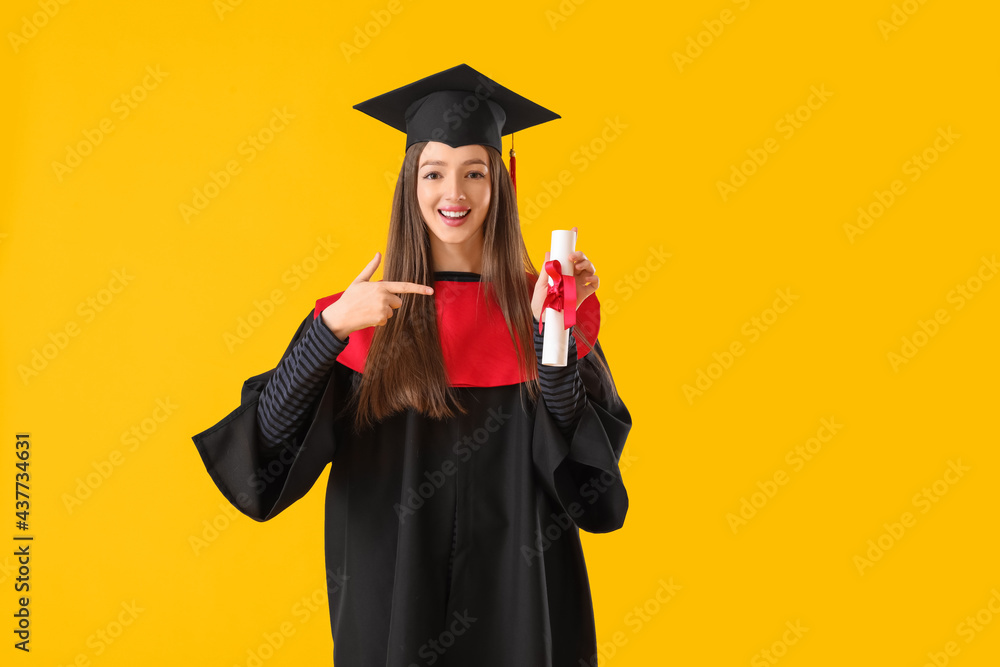 Female graduating student with diploma on color background