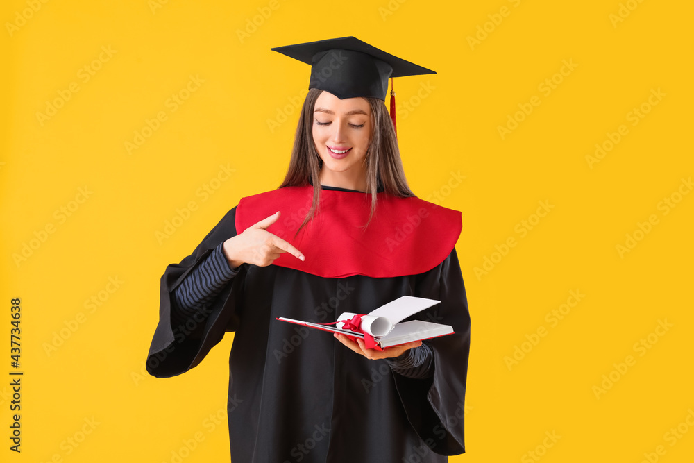 Female graduating student with diploma and book on color background