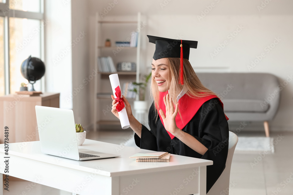 Happy female student on her graduation day at home. Concept of online education