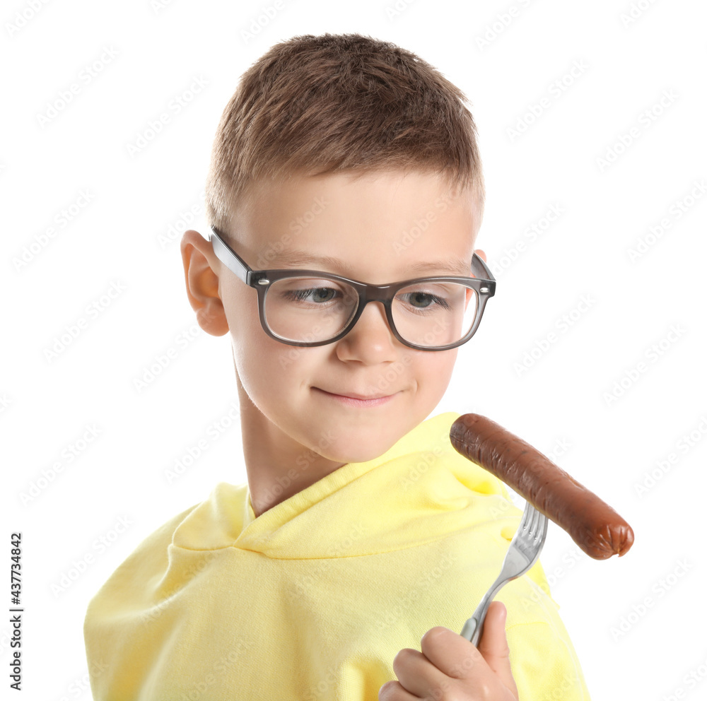 Little boy with tasty sausage on white background