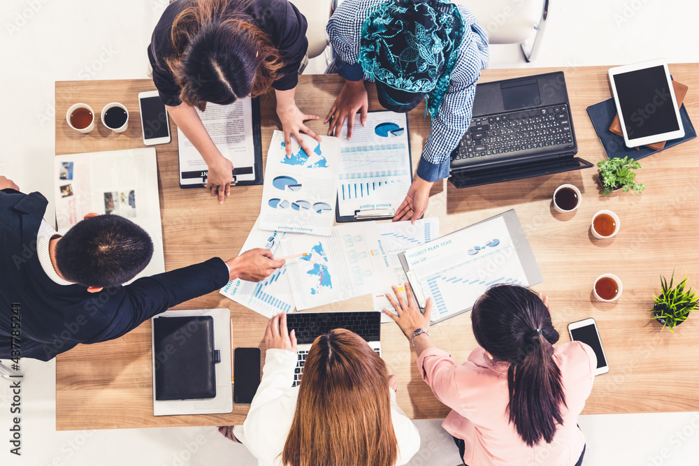 Top view of businessman executive in group meeting with other businessmen and businesswomen in moder