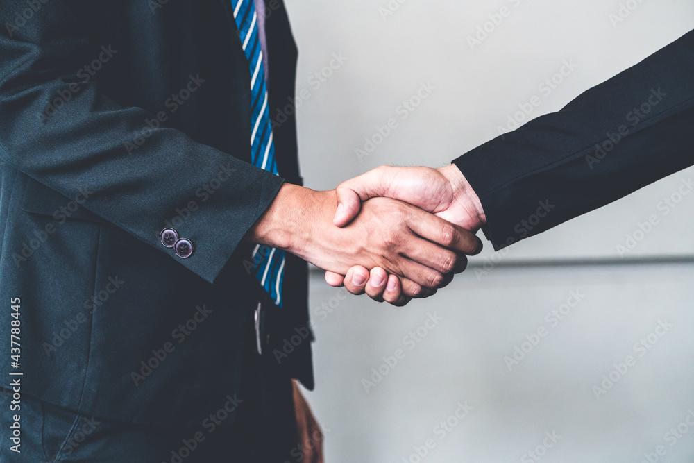 Business people agreement concept. Businessman do handshake with another businessman in the office m