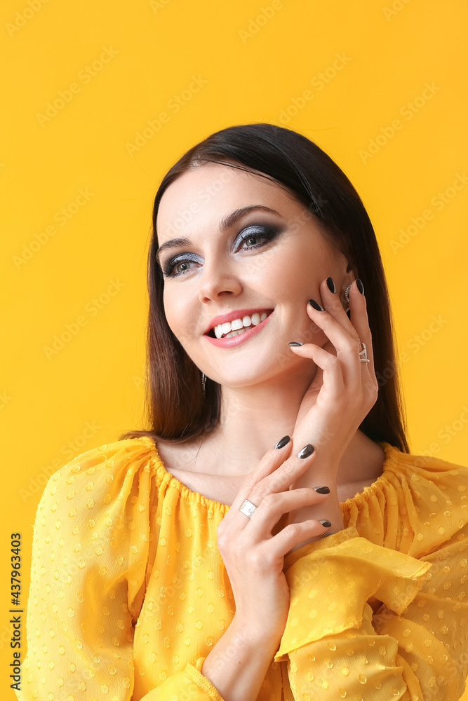 Young woman with beautiful manicure on color background