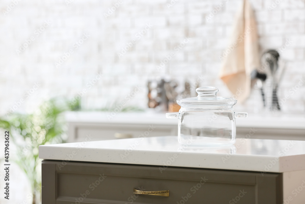 Stylish cooking pot on counter in kitchen