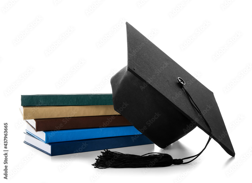 Graduation hat with books on white background