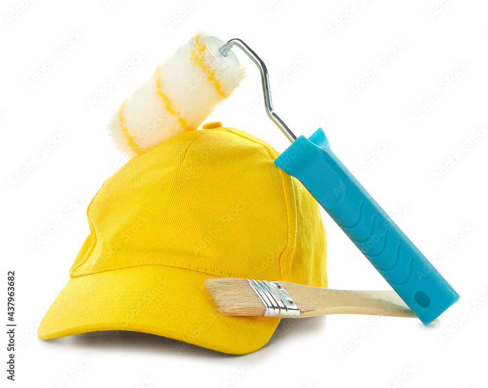 Cap with roller and brush on white background