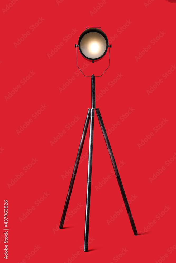 Modern lamp on color background