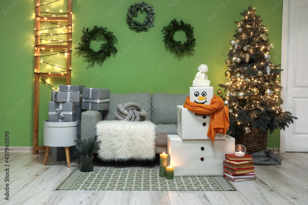 Funny snowman in living room decorated for Christmas