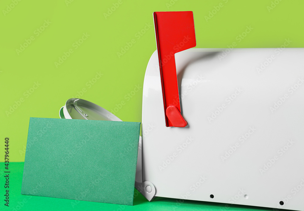 Mail box with letter on color background