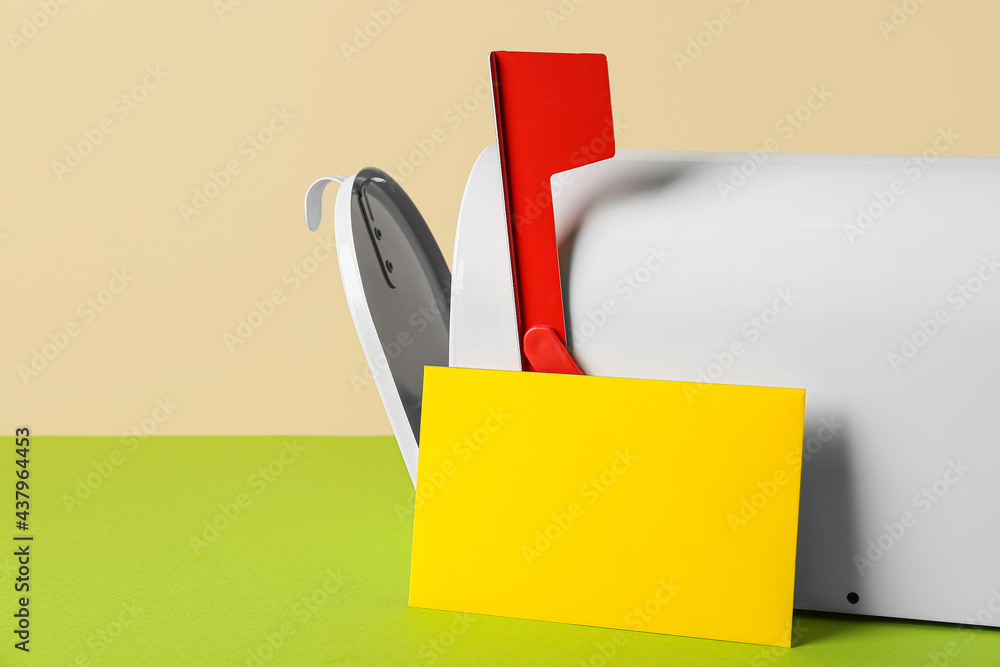 Mail box with letter on color background