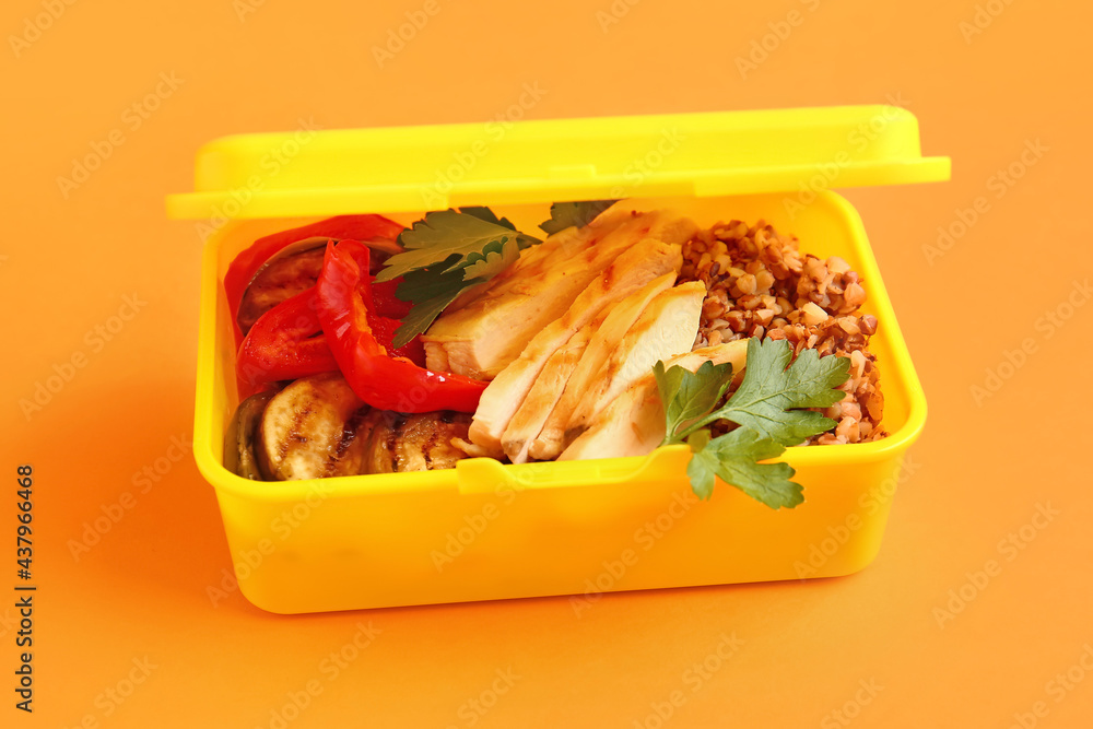 Lunch box with tasty food on color background